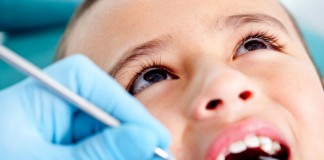 Două consultaţii stomatologice gratuite pe an pentru copii