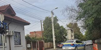 (UPDATE) Prinși și reținuți, apoi eliberați/Focuri de armă pe Democrației. Scandal între două familii, stradă blocată